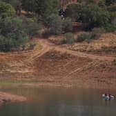 Portuguese firefighterOfficials are seen during a new search operation amid the investigation into the disappearance of Madeleine McCann in the Arade dam, in Silves, near Praia da Luz, on 23 May, 2023.
