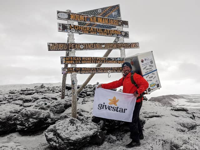 Michael Copeland from Stafford, on his climb up Kilimanjaro with a fridge on his back. The former soldier has conquered Africa's highest mountain whilst carrying a fridge on his back to encourage men to talk about mental health with MIND.