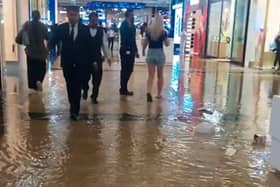 Water was seen gushing from the ceiling of shop after it partially collapsed due to heavy rain.