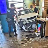 Man injured as car crashes into busy McDonalds