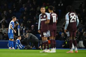 Brighton striker Stefanos Tzimas receives treatment against Aston Villa