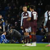 Brighton striker Stefanos Tzimas receives treatment against Aston Villa