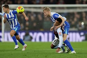 Brighton defender Jan Paul van Hecke was forced off at Aston Villa