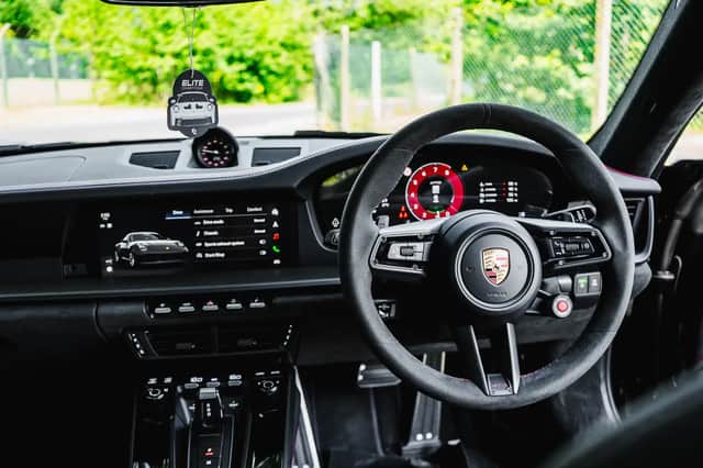 One winner will choose between the near-new Porsche 911 GTS and a six-figure tax-free cash prize