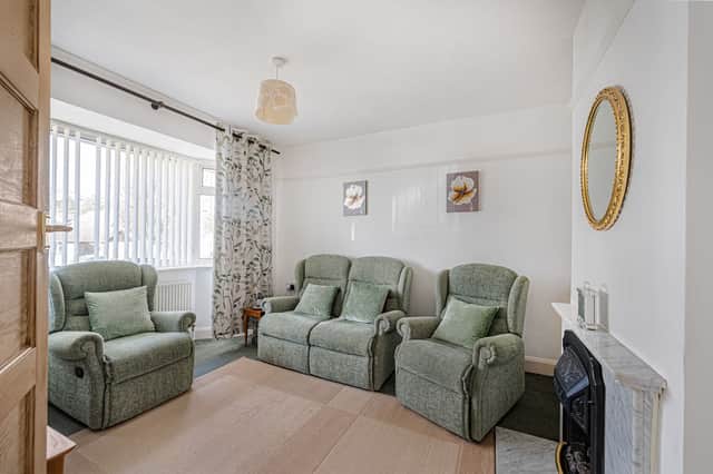 The lounge forms one of the principal living spaces inside the well-laid-out bungalow