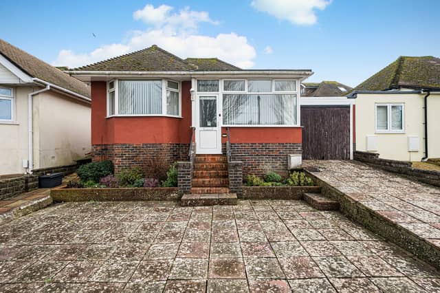The detached Saltdean bungalow has a west-facing sun loggia and driveway with off-road parking