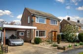 The Wells Close home has a low-maintenance front garden, driveway parking and a large carport 