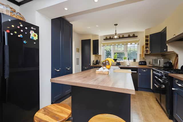 Upgraded in 2022, the kitchen and dining area features a log burner and provides a central space for family meals and entertaining