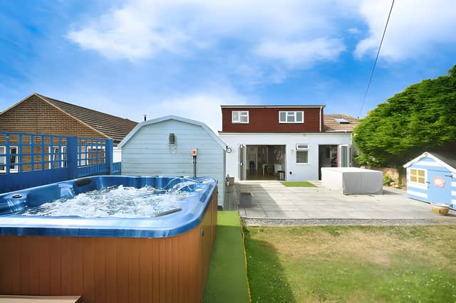 The semi-detached bungalow occupies a cliff-top position on The Promenade in Peacehaven