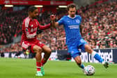 Brighton's French defender Olivier Boscagli in action against Liverpool at Anfield
