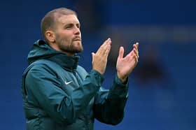 Head coach Fabian Hurzeler applauds the Brighton fans