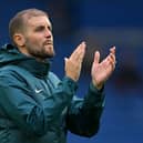 Head coach Fabian Hurzeler applauds the Brighton fans