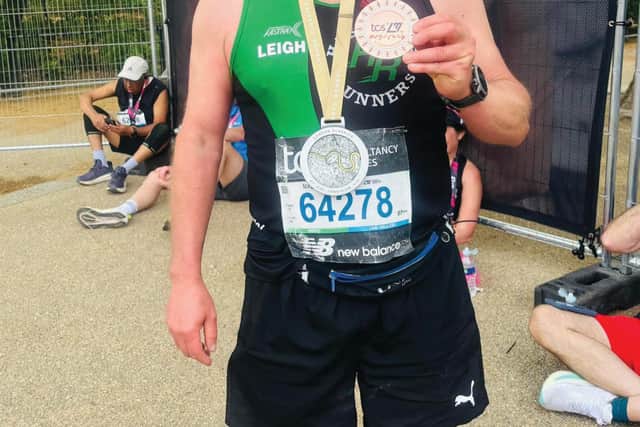 Hastings Runners’ Leigh Yates proudly displays his London Marathon finishers medal.