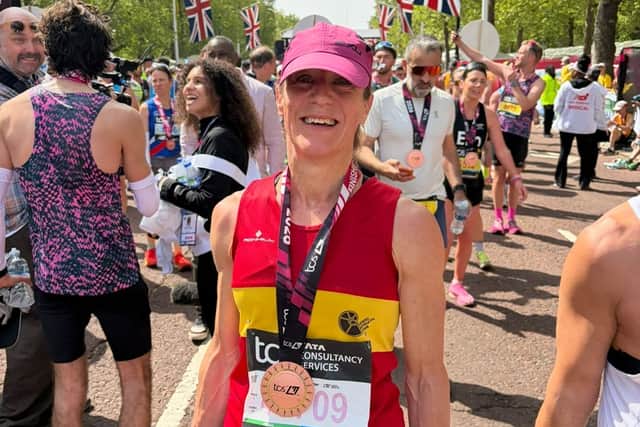 Lewes AC runner Heidi Hodgson celebrates at the finish of the London Marathon.
