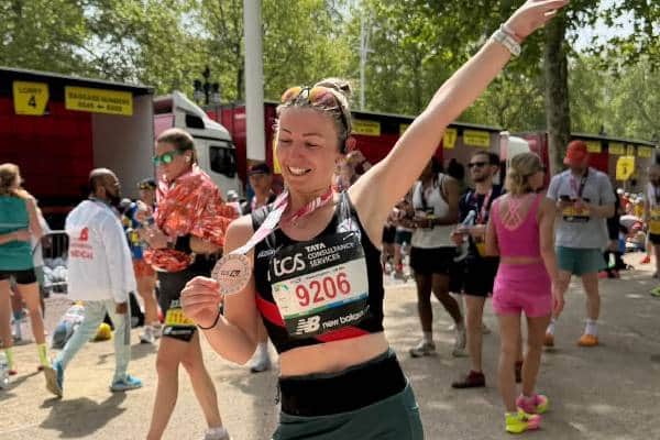Hailsham's Sarah Day celebrates a 16 minute personal best at the 2026 London Marathon.