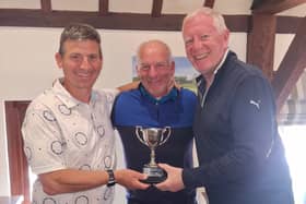 Matt Price and Ian Cherriman win the Midsummer Cup, presented by Bob Andrews.