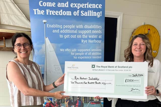 Home Services Advisor, Sharon Ward from Barchester's Hazel Lodge Care Home presenting the donation to Sheila Davison from Rye Harbour Sailability