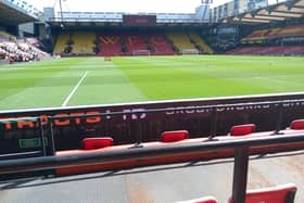 135pm looking out from the vicarage road end, Elton John. on the left, Graham Taylor on the right