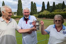 David Clifton presenting the trophy to the happy winners 
