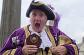 Town Crier picking up her trophy for 1st Place