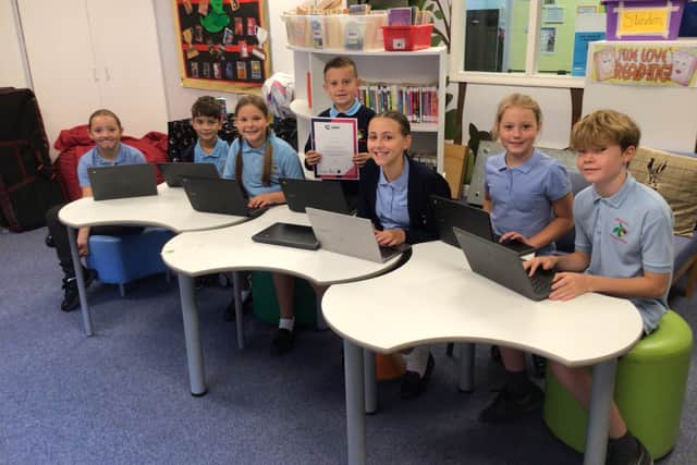 Children at Slindon CofE Primary School celebrating their hard work.