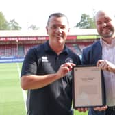 MP for Crawley Peter Lamb gives framed Early Day Motion to head of Foundation Darren Ford