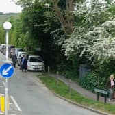 Pedestrians forced to walk on  a rural road