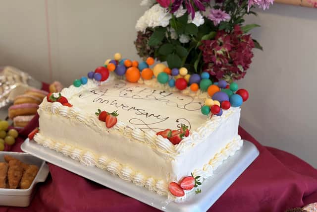 Celebratory cake enjoyed by guests