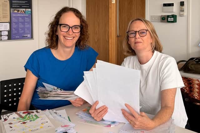 Alison Bennett MP with local artist Kate Harries, judging the entries for the competition.