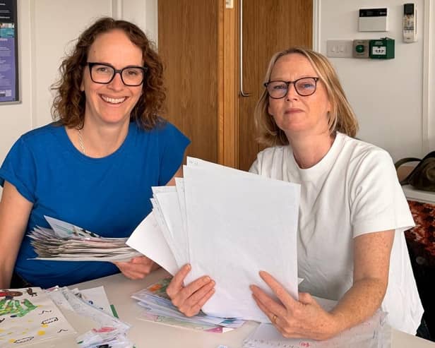 Alison Bennett MP with local artist Kate Harries, judging the entries for the competition.