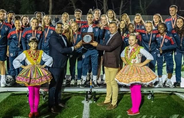 Presentation of 3rd place trophy. Beth just above the left hand girl in Craotian costume