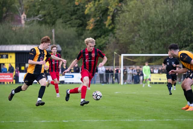 Goalscorer Morgan Prill runs at the East Grinstead defence