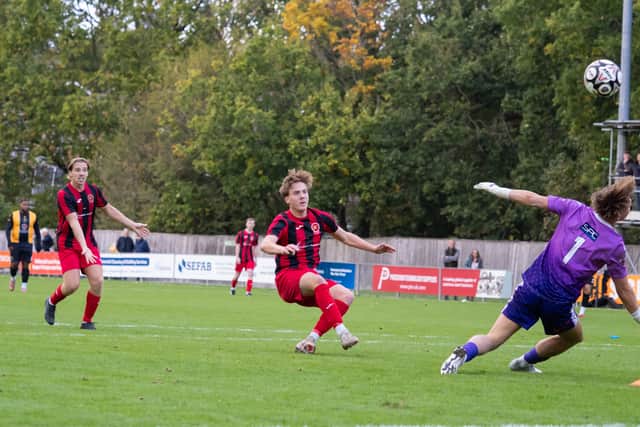 Albie Gooda chance saved by Grinstead keeper Howes