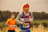 Eventual race winner Graeme McIntosh, just ahead of runner up Phil Payne as they approach the 5kms mark