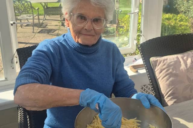 Barbara one of our Daycare residents helping to mix and stir