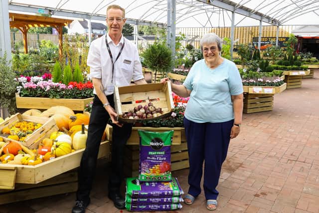 Bridget Quint, lay leader of Southwick Methodist Church who leads the Senior Citizens Group, collects the bulbs from Mayberry Garden Centre’s Chris Arnold.