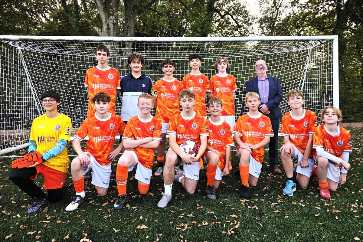 Sponsors Holland Harper visit Battle Town's junior football team as new season kicks off