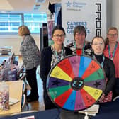 Four members of the college group's career's advice and guidance team at a careers fair.
