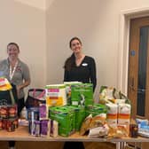 Anna Sharkey 
Bentswood Hub C.I.C. Director  , alongside Specsavers store manager Millie Denyer 