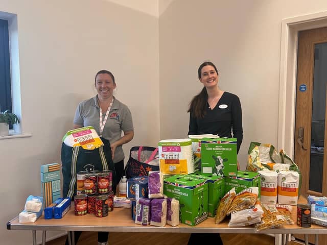 Anna Sharkey 
Bentswood Hub C.I.C. Director  , alongside Specsavers store manager Millie Denyer 