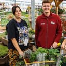 Louie Cobb from Herons Dale Primary School collects the donation of much-needed herbs and plants from Tates Garden Centre.