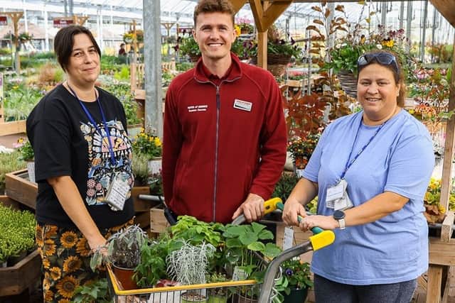 Louie Cobb from Herons Dale Primary School collects the donation of much-needed herbs and plants from Tates Garden Centre.