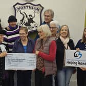 NBS hands cheque to Helpoing Hands