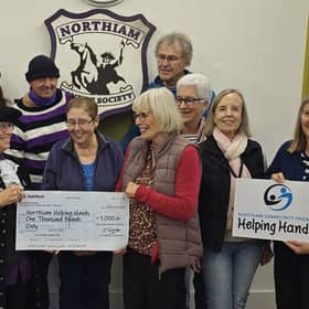NBS hands cheque to Helpoing Hands