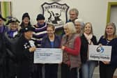 NBS hands cheque to Helpoing Hands