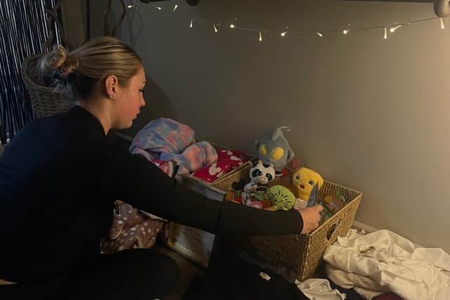 Scarlett from Arch & Lash Co sorting through generous donations for the Christmas Giving Back campaign in support of St Michael’s Hospice, Hastings. 