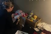 Scarlett from Arch & Lash Co sorting through generous donations for the Christmas Giving Back campaign in support of St Michael’s Hospice, Hastings. ❤️🎄