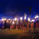 A team from Hastings Runners carries the flame fro the East Hill to the Bonfire Parade.