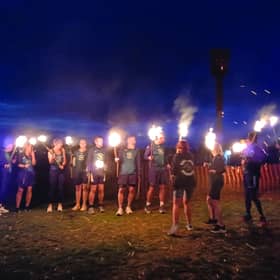 A team from Hastings Runners carries the flame fro the East Hill to the Bonfire Parade.