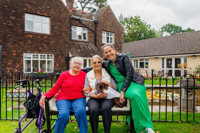 Kate Wyatt celebrates her Channel 5 News ‘Hero of the Week’ award with residents and four-legged friend Selly at The Anchorage Care Home in Pulborough.